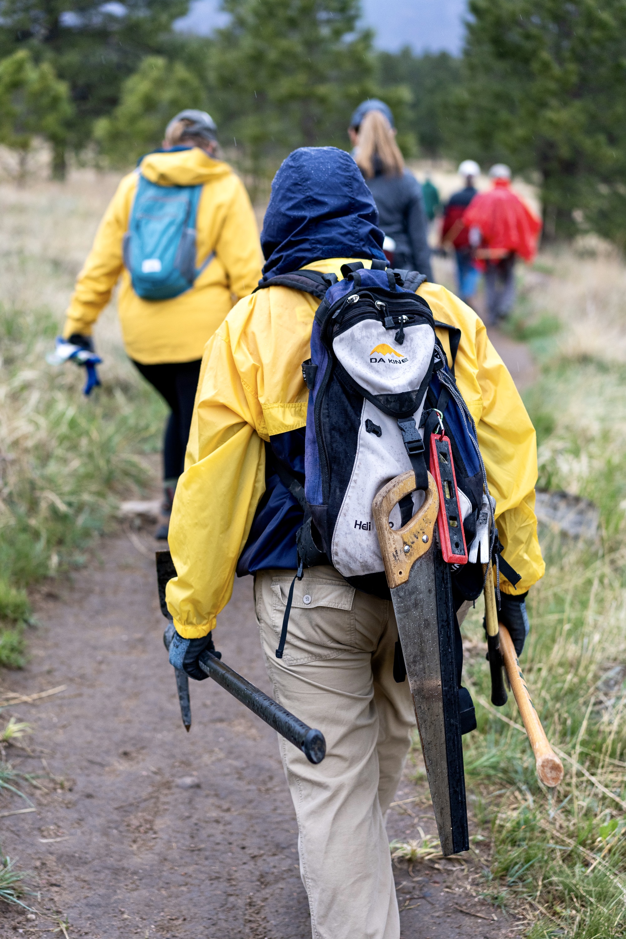 Group of volunteers working together on a park trail project